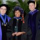 Beattie Award for Excellence in Teaching during the law school's commencement ceremony on Aug. 7. Pictured with Dubose (center) are Associate Dean Daniel Matthews (left) and President and Dean James McGrath.