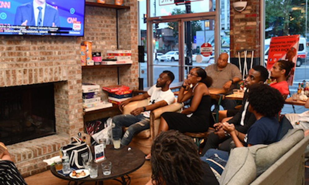Young people gathered at Halfsmoke in Northwest on Tuesday, July 30 to watch the first night of the second round of Democratic debates with members of #BlackYouthVote. (Anthony Tilghman/The Washington Informer)