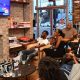 Young people gathered at Halfsmoke in Northwest on Tuesday, July 30 to watch the first night of the second round of Democratic debates with members of #BlackYouthVote. (Anthony Tilghman/The Washington Informer)