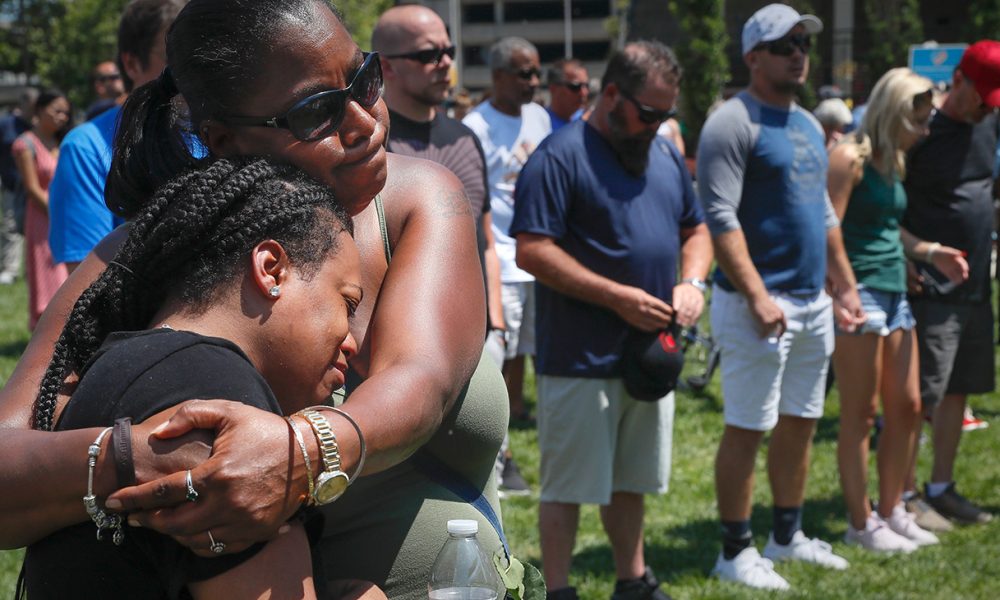 Mourners gather at a vigil following a nearby mass shooting Aug. 4, in Dayton, Ohio. Multiple people in Ohio have been killed in the second mass shooting in the U.S. in less than 24 hours, and the suspected shooter is also deceased, police said. Photo: AP/Wide World Photos