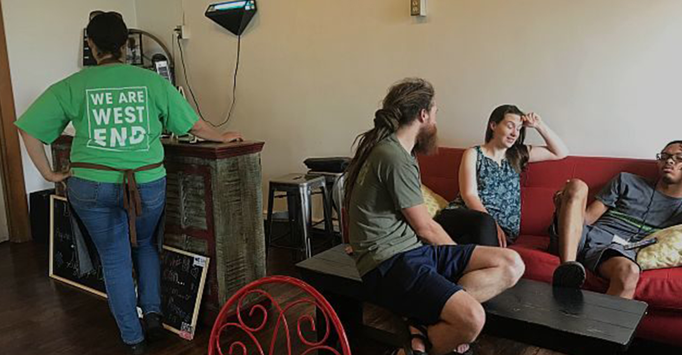 Urban Ministry supporters include WE (West End) Cafe workers and patrons enjoying the cozy lunch atmosphere on a busy Wednesday in June. (Photo by: Keisa Sharpe)