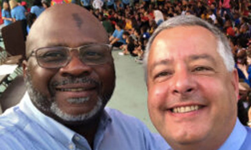 Vistra Communications CEO Brian Butler, left, is shown with former Mort Elementary School Principal Woodland Johnson.