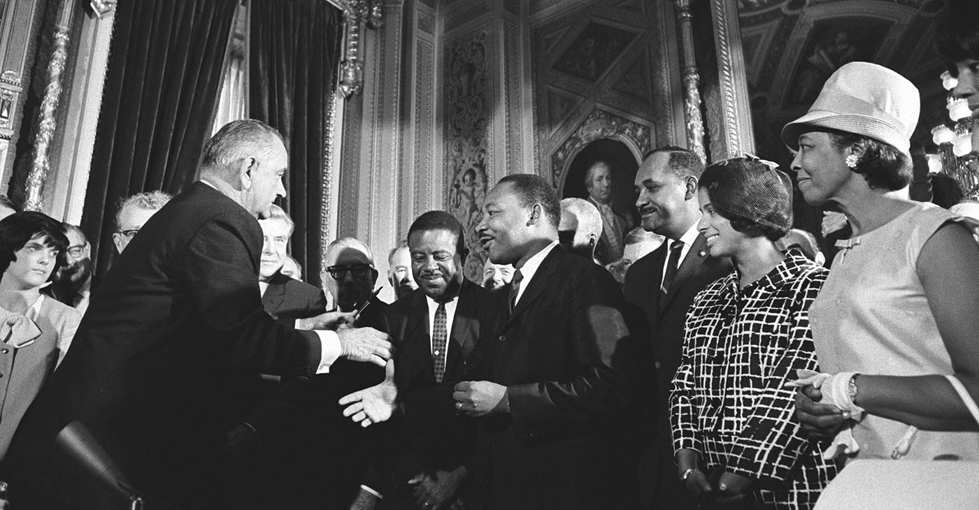 President Lyndon B. Johnson meets with Martin Luther King, Jr. at the signing of the Voting Rights Act of 1965 (Lyndon Baines Johnson Library and Museum. Image Serial Number: A1030-17a. http://www.lbjlibrary.net/collections/photo-archive/photolab-detail.html?id=222 / Wikimedia Commons)