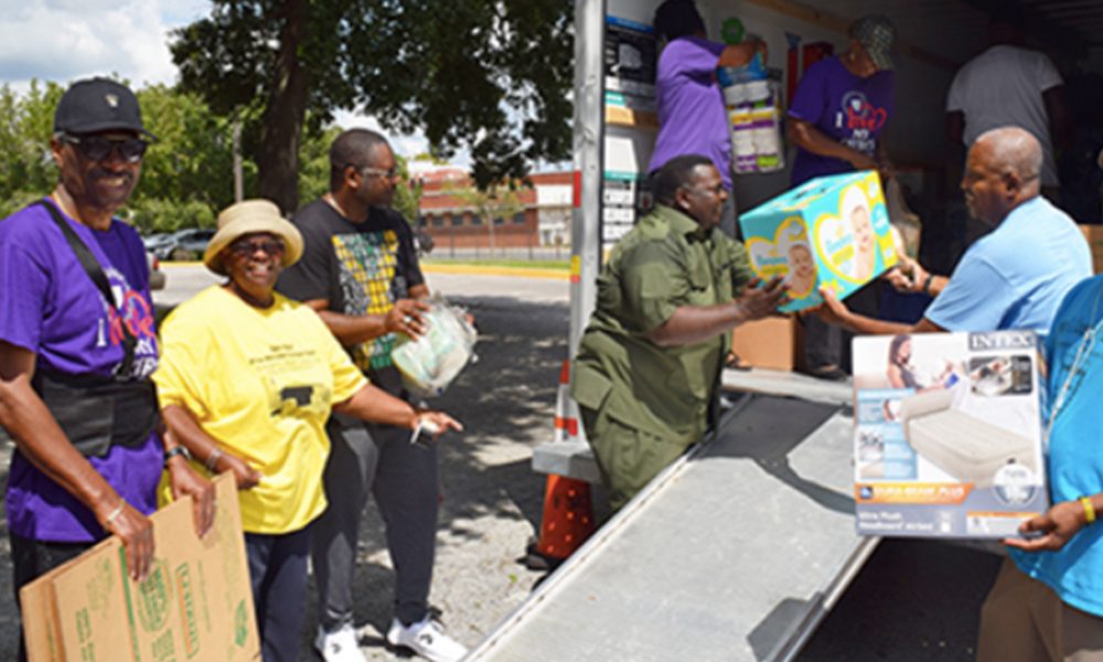Shown loading the Dorian Hurricane relief truck (l-r) are: Reverend Roger Williams, Reverend Victor Cole, Reverend David Green, Larry West and Stacey West
