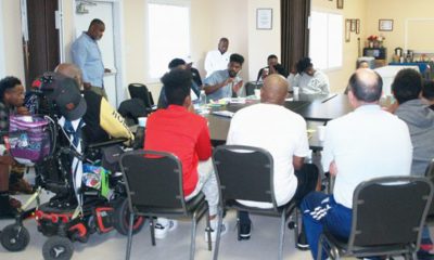Leshawn Holcomb (center) leads the discussion group at the Fatherhood Council. (Photo by: Godfrey Lee)