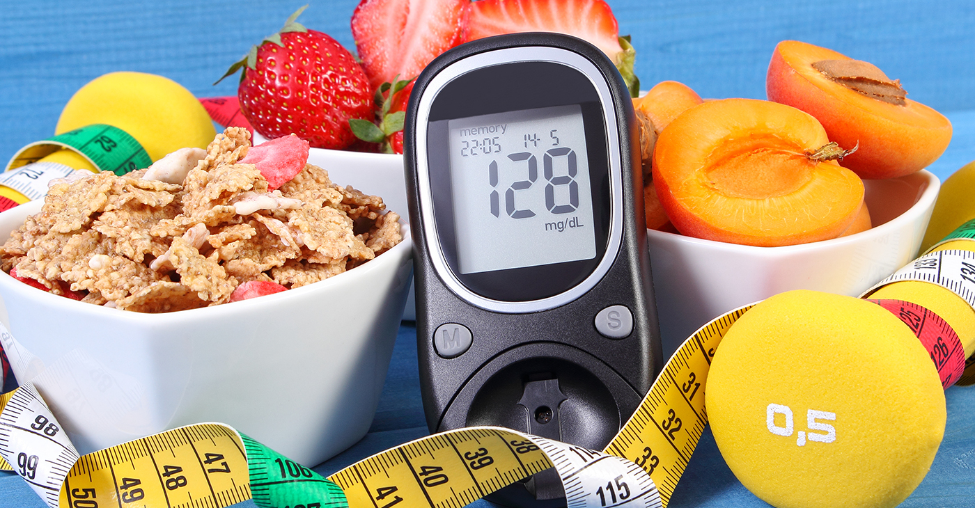 Glucose meter with result sugar level, healthy food, dumbbells and centimeter, diabetes (Photo by: Ratmaner)