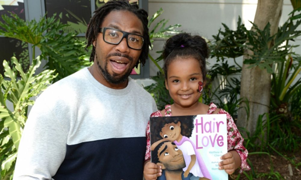 Matthew A. Cherry with a Hair Love fan at one of the Hair Love events. (Photo Credit: Courtesy of Sony Pictures Animation)