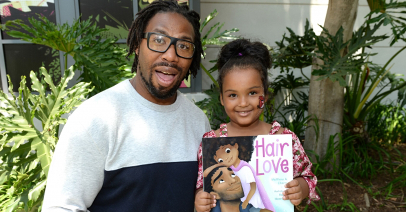 Matthew A. Cherry with a Hair Love fan at one of the Hair Love events. (Photo Credit: Courtesy of Sony Pictures Animation)