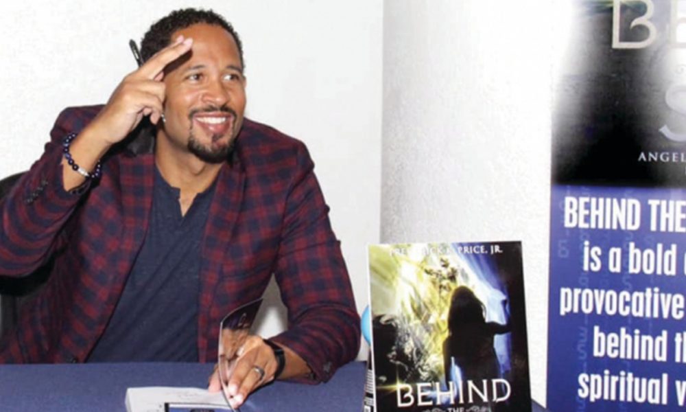 Pastor Frederick Price Jr. signed hundreds of books at the reception. (Photo by: Richard Ventura | CCC)