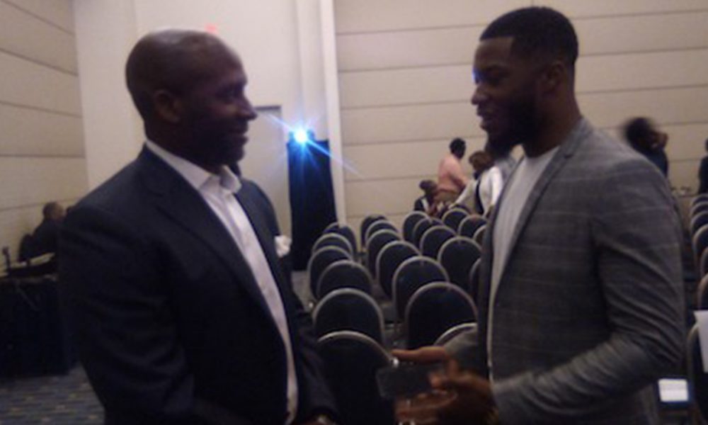 Thomas Penny III talks with mentee Arturo Evans at the My Brother's Keeper Summit & Volunteer Fair at the Walter E. Washington Convention Center in Northwest on Sept. 5. (James Wright/The Washington Informer)