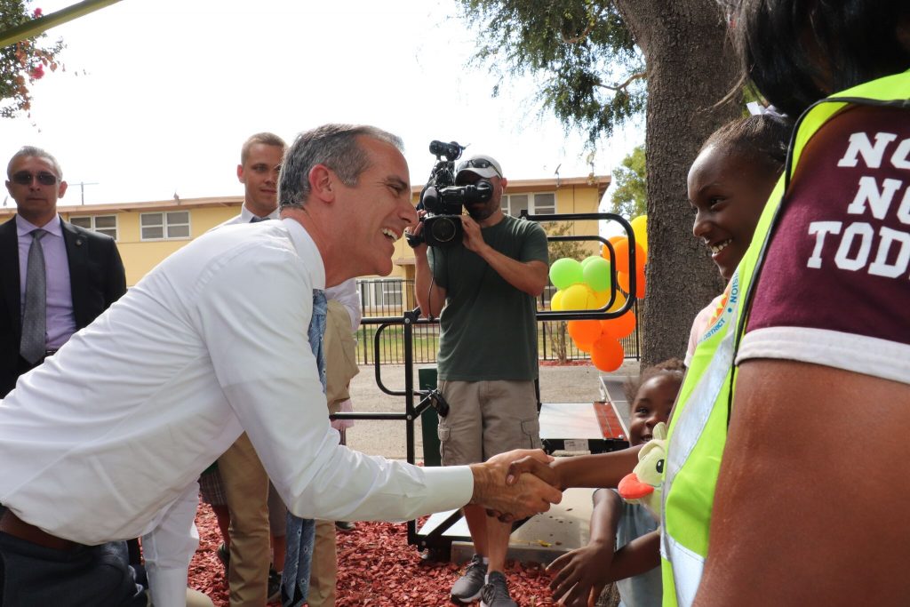 Mayor Garcetti greeting children of Nickerson Gardens (Courtesy Housing Authority of the City of Los Angeles)