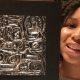 Zoe holding her first repousse piece created in MICA’s after school arts program, that she sold to Fogo de Chao manager. (Photo by Latease Lashley)