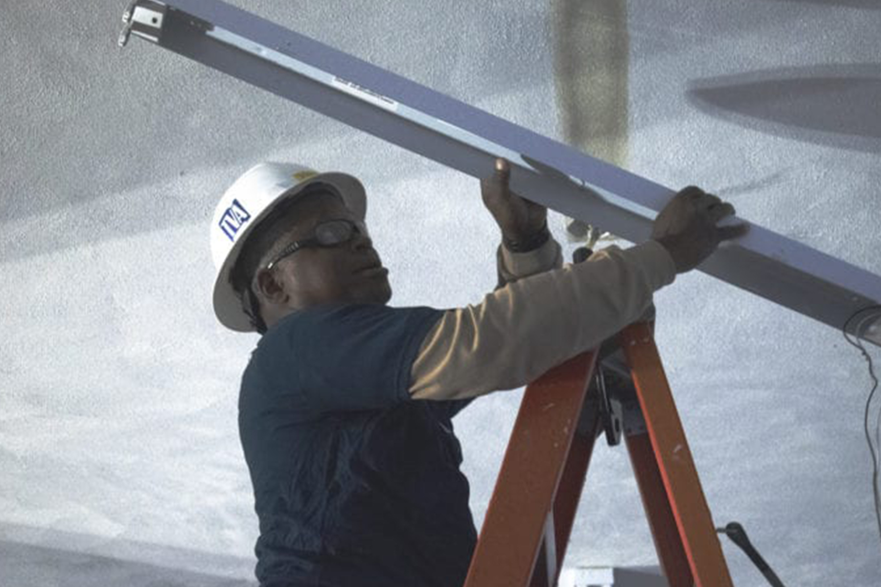 New lighting for locker rooms was on the wish list for Riverview K-8 School administrators and TVA associates put in the work to make that happen this past Monday. (Photo by: Karanja A. Ajanaku)