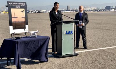 LAWA Chief Executive Officer Deborah Flint (left) speaks alongside Michael Huerta, who served as Administrator of the Federal Aviation Administration from 2011-2018, at a press event at Los Angeles International Airport.
