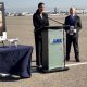LAWA Chief Executive Officer Deborah Flint (left) speaks alongside Michael Huerta, who served as Administrator of the Federal Aviation Administration from 2011-2018, at a press event at Los Angeles International Airport.