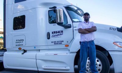 Byron Alderman, from Mississippi, was in Indianapolis Oct. 4 to bring awareness to issues truckers like him will face with advancing automation and safety requirements. He's part of Truckers United on 10-4 and stood next to Paul Massett's cab. Massett is from Ohio. (Photo by: Tyler Fenwick)