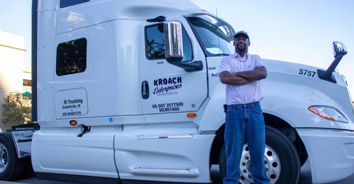 Byron Alderman, from Mississippi, was in Indianapolis Oct. 4 to bring awareness to issues truckers like him will face with advancing automation and safety requirements. He's part of Truckers United on 10-4 and stood next to Paul Massett's cab. Massett is from Ohio. (Photo by: Tyler Fenwick)