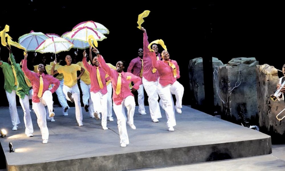 Latanya d. Tigner leads members of Dimensions Dance Theater. (Photo by: Jay Yamada).