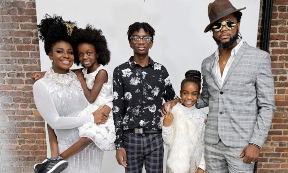 Mushiysa Tshikuka and Louis Smith posing with their children to celebrate the grand opening of Runway Curls Salon Suites (Photo by: Datrick Davis of DaeRaeMedia)