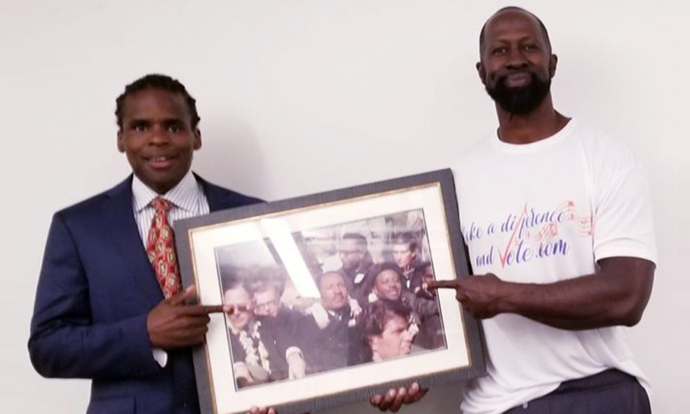 Voter registration advocates Charles Patton, creator of www.makeadifferenceandvote.com, and Jonathan Fitness Jones hold iconic photo of Oakland Post publisher Paul Cobb and three other Oakland residents beside Dr.Martin Luther King, Jr. during the height of the Civil Rights Movement, a galvanizing of the masses that demanded change resulting in the landmark Voting Rights Act 1965. Voter registration advocates Charles Patton, creator of www.makeadifferenceandvote.com, and Jonathan Fitness Jones hold iconic photo of Oakland Post publisher Paul Cobb and three other Oakland residents beside Dr.Martin Luther King, Jr. during the height of the Civil Rights Movement, a galvanizing of the masses that demanded change resulting in the landmark Voting Rights Act 1965. (Photo by: Paul Cobb)