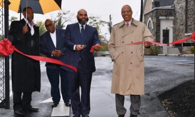 Pastor Darryl Gould, Sr., of Gillis Memorial Christian Community Church and Maryland Lt. Gov. Boyd Rutherford, cut the ribbon to celebrate the opening of the church’s new multi-purpose parking lot. (Courtesy photo)