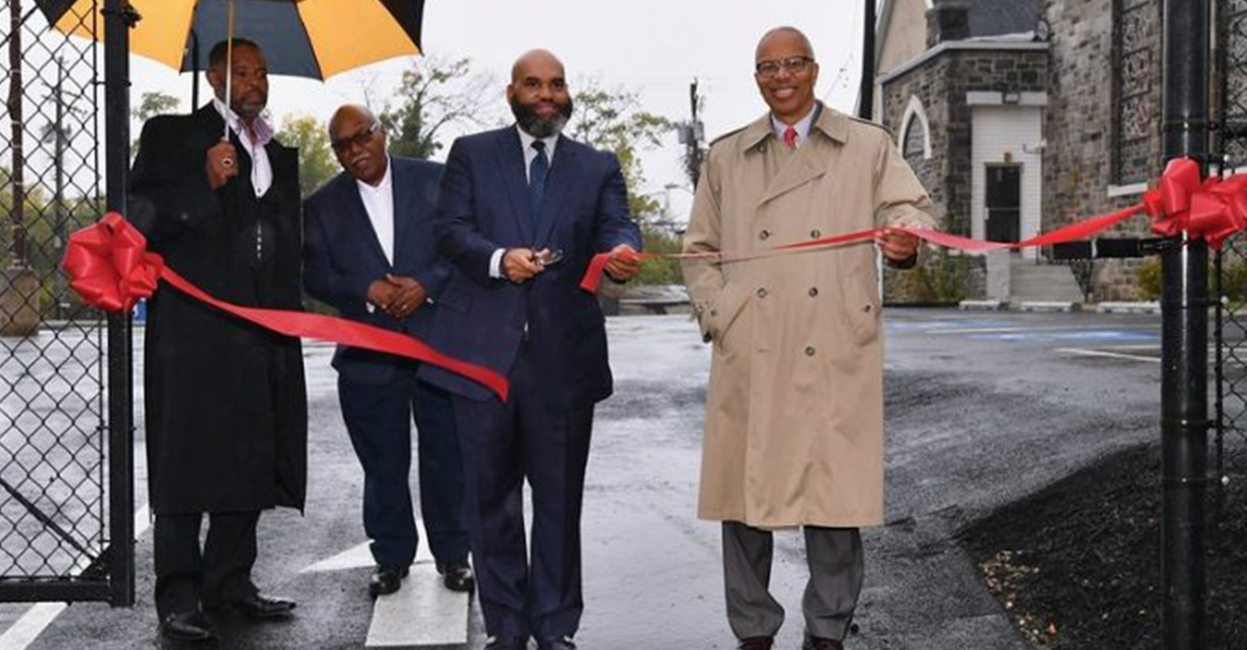 Pastor Darryl Gould, Sr., of Gillis Memorial Christian Community Church and Maryland Lt. Gov. Boyd Rutherford, cut the ribbon to celebrate the opening of the church’s new multi-purpose parking lot. (Courtesy photo)