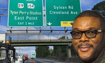 Tyler Perry in front of a sign directing motorists to his studios near downtown Atlanta (Image source: Instagram – @tylerperry)
