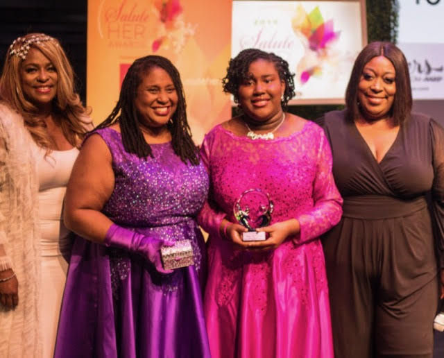 Flanked by Cafe Mocha radio co-hosts Rapper Yo-Yo (left) and daytime television host Loni Love (right), Tosha Terry and Madelynn Martin (both centered) received the “Salute Her” family legacy award at a ceremony held last month. (Courtesy Photo