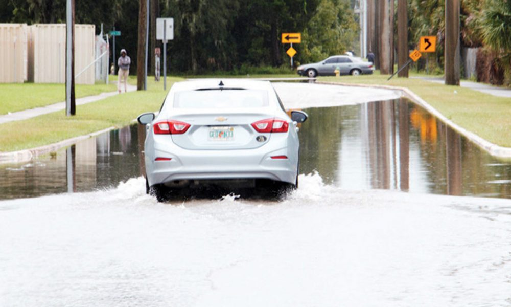 A car tries to maneuver down Keech Street near Campbell Middle School. (Photo by: Duane C. Fernandez Sr. | hardnottsphotography.com)