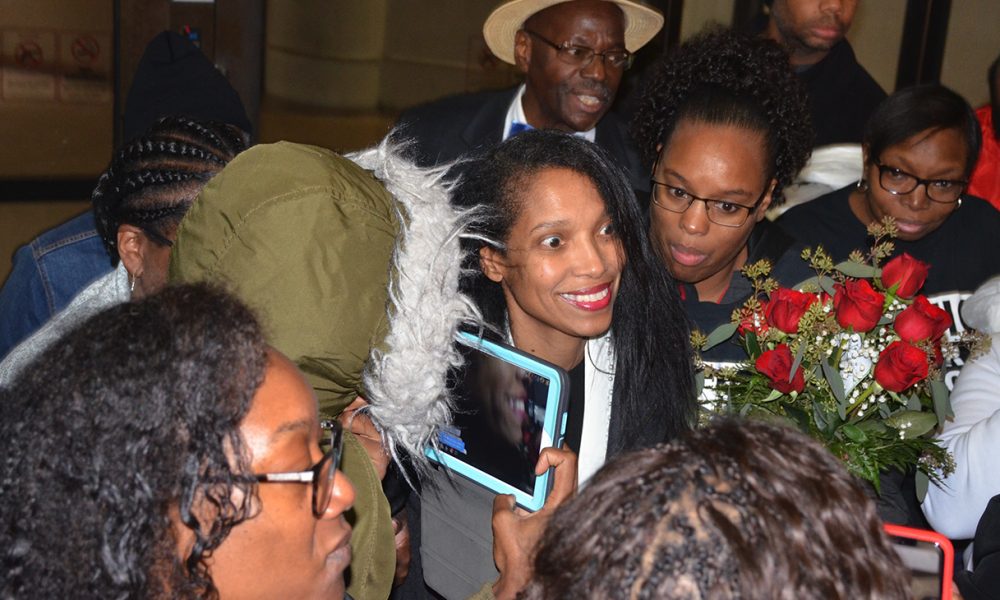 Tracie Hunter is surrounded by relatives and friends immediately after being released and stepping outside the Hamilton County Justice Center at 6 a.m. Saturday, October 5. Photo by Dan Yount/The Cincinnati Herald