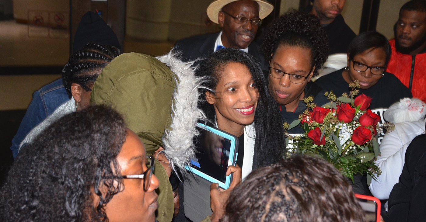 Tracie Hunter is surrounded by relatives and friends immediately after being released and stepping outside the Hamilton County Justice Center at 6 a.m. Saturday, October 5. Photo by Dan Yount/The Cincinnati Herald