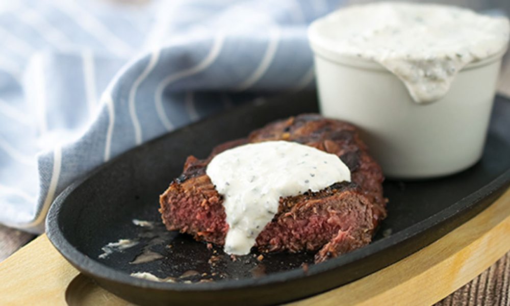 Horseradish and Chive Sauce over Omaha Steaks Private Reserve Boneless New York Strip