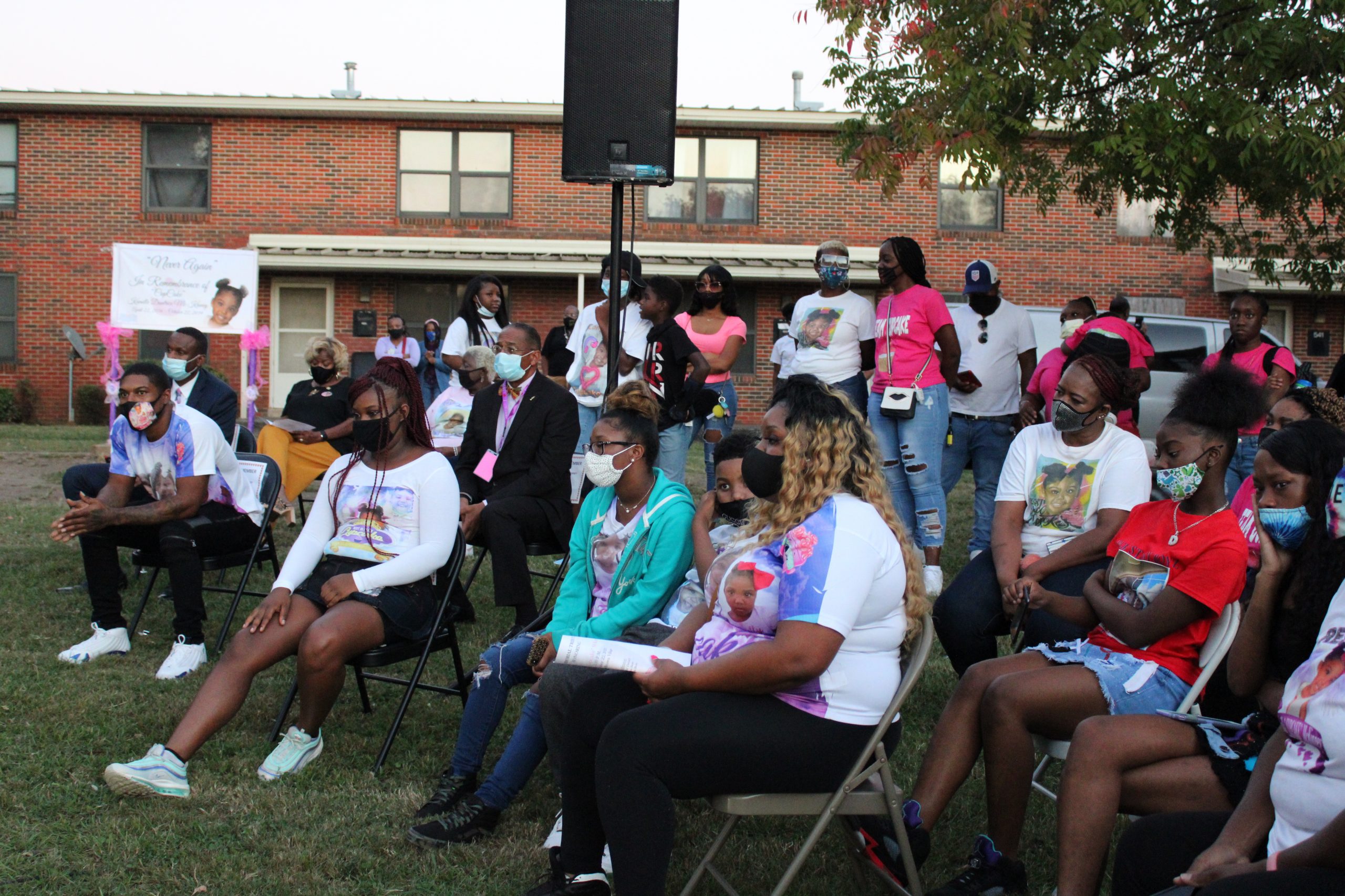 Family and friends of Kamille "Cupcake" McKinney listened during a service for the 3-year-old who was kidnapped a year ago. (Sydney Melson, for The Birmingham Times) 