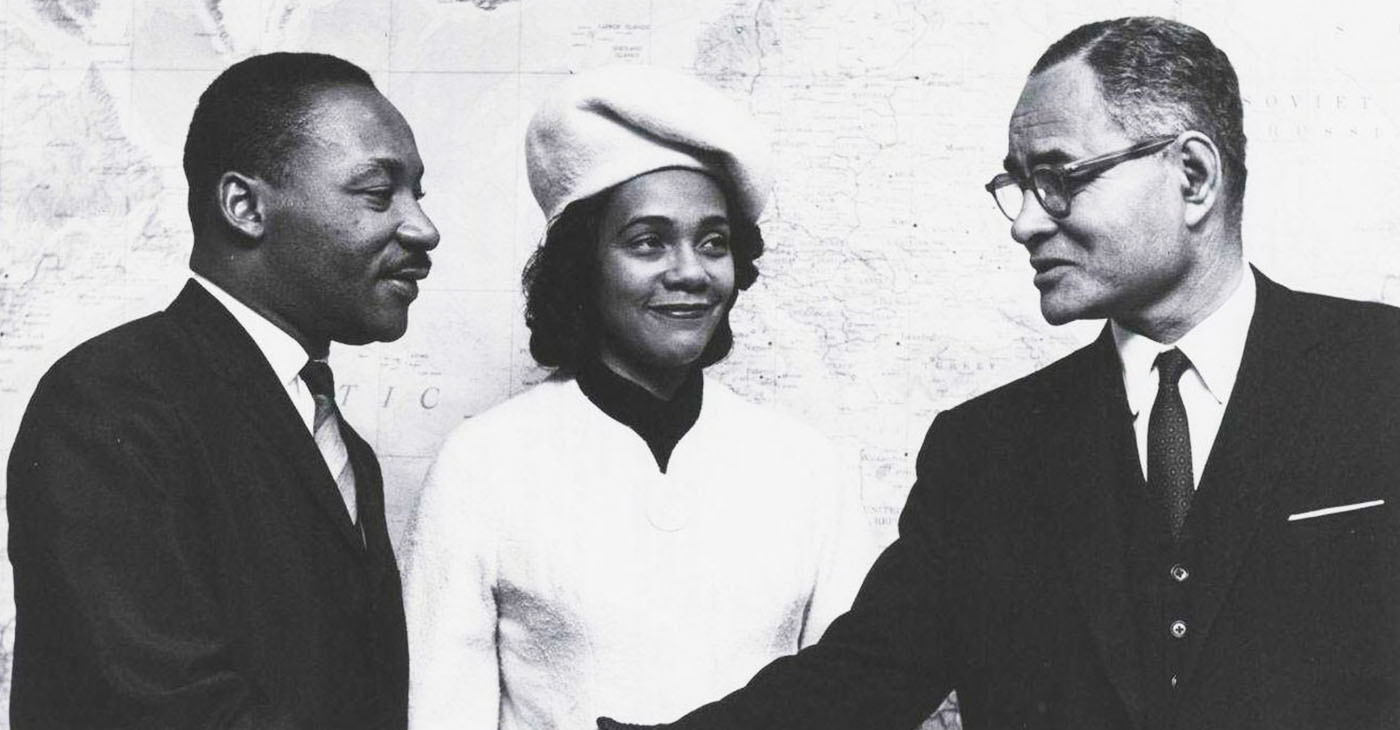 Dr. Ralph J. Bunche (far right) greets Rev. Dr. Martin Luther King Jr. (left) and Coretta Scott King (center). (Photo: ucla.edu)