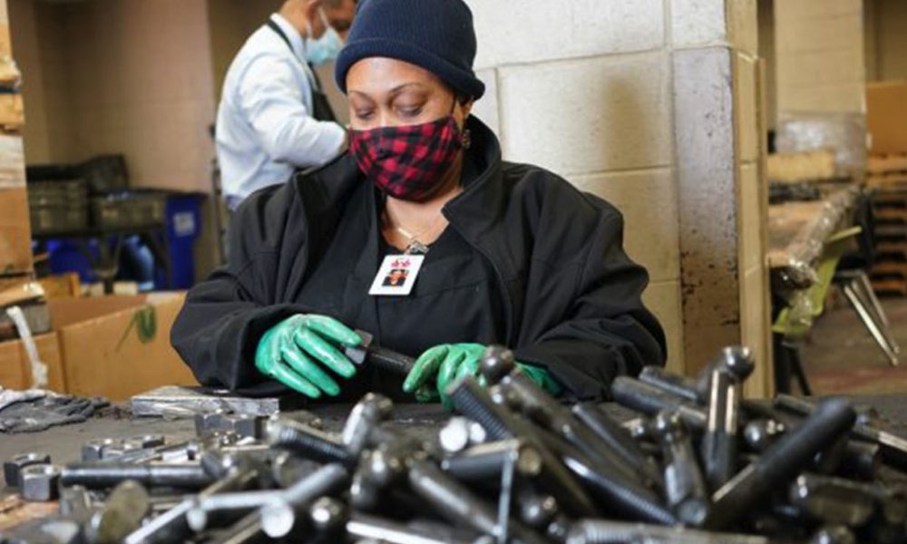 Kinisha Bester works with nuts and bolts at Workshops Empowerment Inc. in Avondale. (Marvin Gentry, For the Birmingham Times)