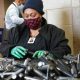 Kinisha Bester works with nuts and bolts at Workshops Empowerment Inc. in Avondale. (Marvin Gentry, For the Birmingham Times)