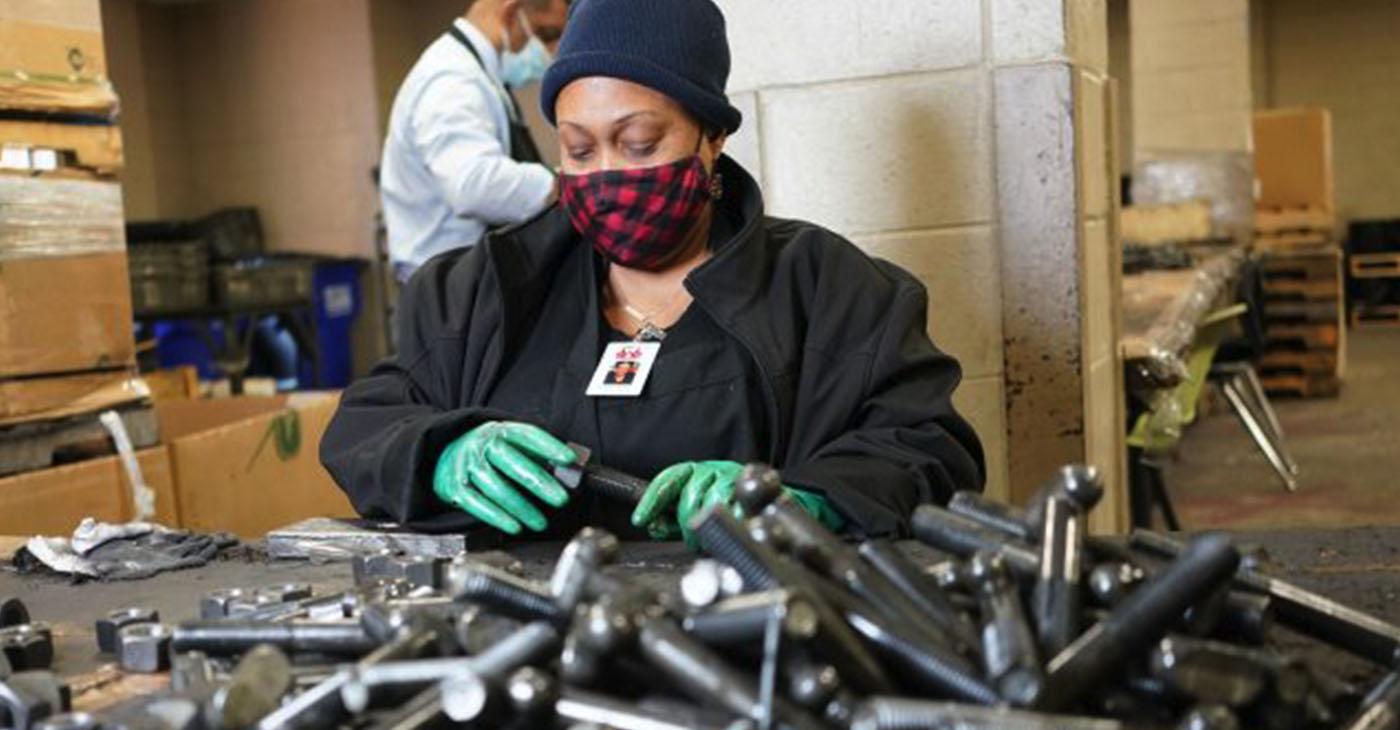 Kinisha Bester works with nuts and bolts at Workshops Empowerment Inc. in Avondale. (Marvin Gentry, For the Birmingham Times)