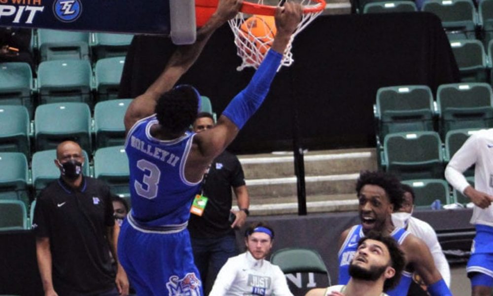 Landers Nolley II exploded for 24 points in the second half, including this dunk, which fired up the Tigers. (Photo: Terry Davis)