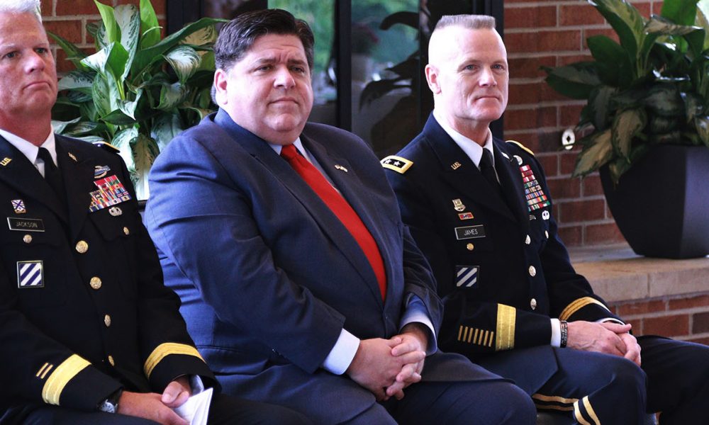 Illinois Governor JB Pritzker, First Army Commander Lt. Gen. Thomas S. James and Illinois National Guard Deputy Assistant Adjutant General - Army Brig. Gen. Mark Jackson listen to Illinois Department of Veteran Affairs Acting Director Linda Chapa LaVia speak during the Gold Star Mothers Luncheon The Illinois Department of Veteran Affairs Gold Star Mothers Luncheon gives senior civilian and military leaders a chance to thank Gold Star mothers for their service to our nation and its military. Governor JB Pritzker thanked the Gold Star Mothers and said he was humbled to have the opportunity to speak with them. In addition to the sacrifice their sons and daughters gave to their nation, many Gold Star mothers keep their Fallen Heroes memories alive and continue their service to the community and to the military, said Lt. Gen. Thomas S. James, the Commander of First Army and keynote speaker at the luncheon. The luncheon was held at the First Infantry Division Museum at Cantigny in Wheaton, Illinois, on Sunday, Sept. 29. (Photo: Lt. Col. Bradford Leighton / Wikimedia Commons)
