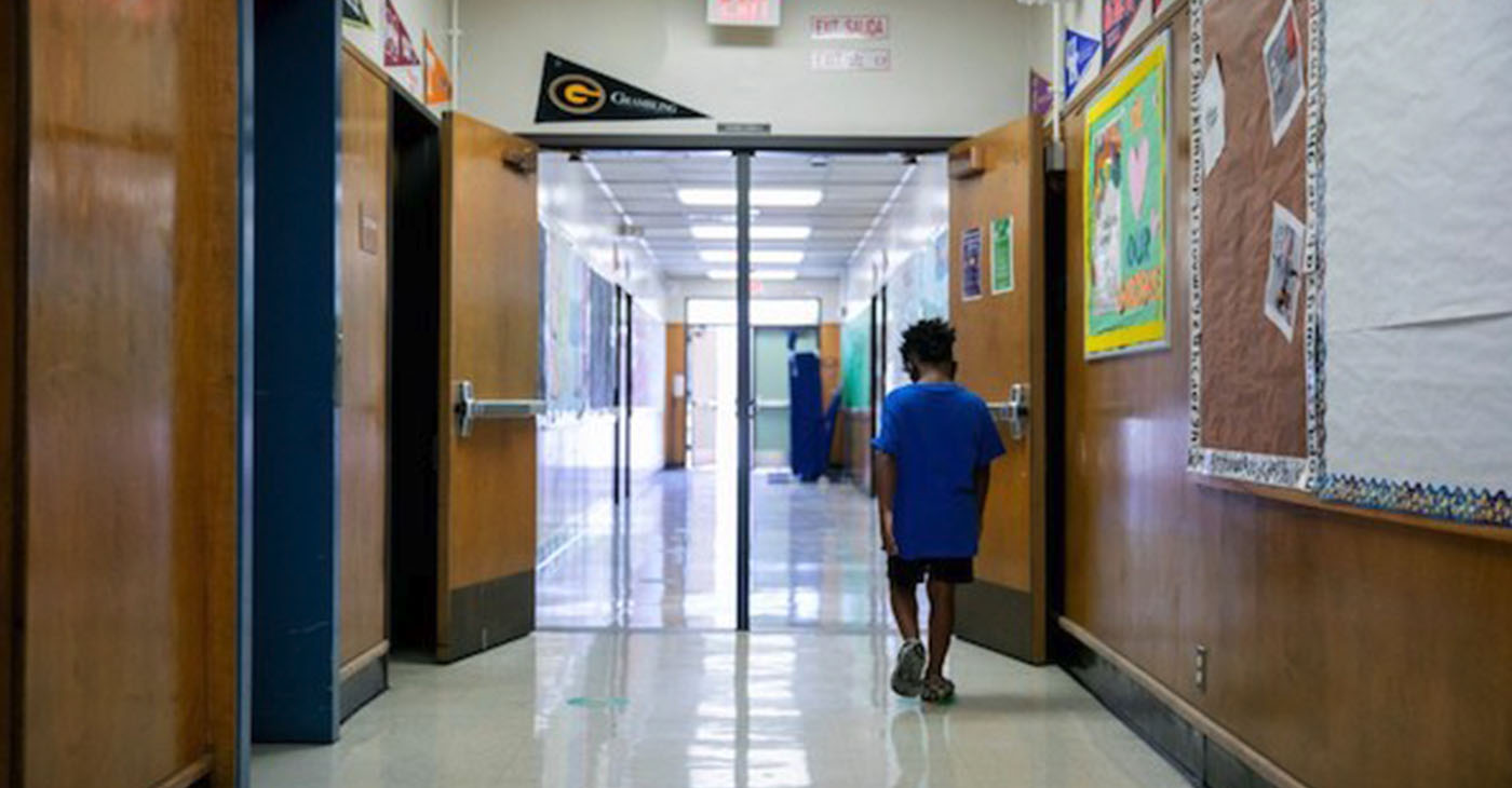 A student walks through Laurel Elementary in Oakland on June 11, 2021. Photo by Anne Wernikoff, CalMatters