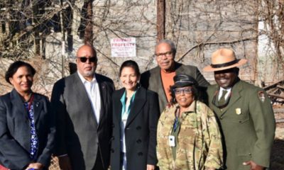 (l-r) Brenda Mallory, CEQ chair, Rep. Bennie Thompson, DOI Secretary Deb Haaland, Rev. & Mrs. Wheeler Parker Jr. and Cassius Cash, NPS deputy regional director. Their first tour stop was at the now dilapidated Bryant’s Grocery in Greenwood, MS Photos by Kevin Bradley