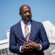The competition between Senator Warnock and Walker is important because it impacts which party will drive policy in the U.S. Senate. (Photo: Senator Raphael Warnock at the Delta Flight Museum mass vaccination site / Flickr)