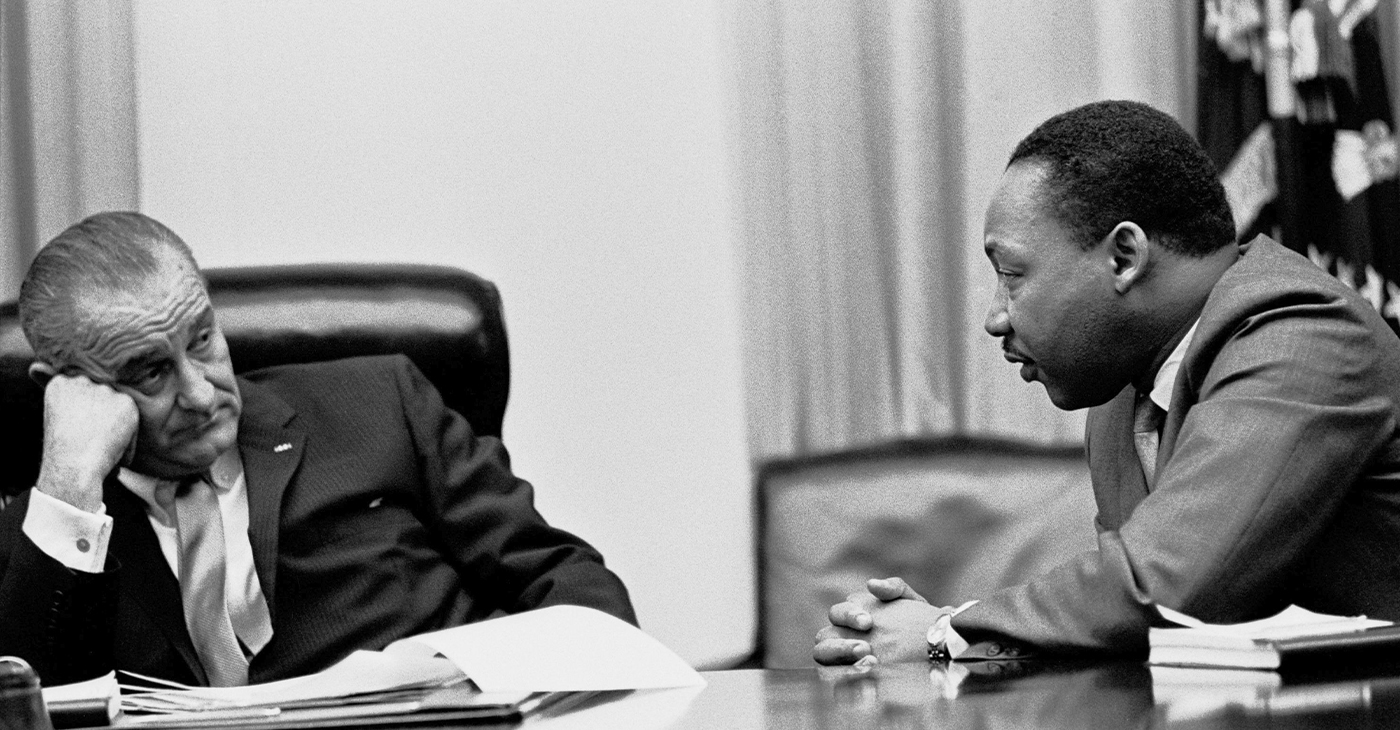 According to Dr. King, the creation of a beloved community would require the American people to address three great evils of society: racism, poverty, and militarism. Photo: President Lyndon B. Johnson meets with Martin Luther King, Jr. in the White House Cabinet Room, 18 March 1966. Lyndon Baines Johnson Library and Museum. Image Serial Number: A2134-2A. http://photolab.lbjlib.utexas.edu/detail.asp?id=18256