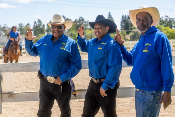 Cowboys Gregory, “Big G" Bradley (left) Joe Cummings (center) and Dan Doris pose with the Loyalty Riderz sign at the B&L Stables in Elk Grove, where some members take riding lessons and board horses. Russell Stiger Jr., OBSERVER 