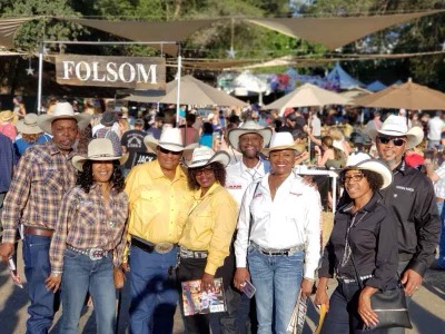 Not all Loyalty Riderz members own or ride horses. Some own RVs, like co-founders Lela Randolph-Lacy and her husband Roy Lacy, third from left in white shirts. Despite having moved to Texas, the couple still travels with the group for campouts and in support of rodeo and cowboy functions. Courtesy Lela Randolph-Lacy