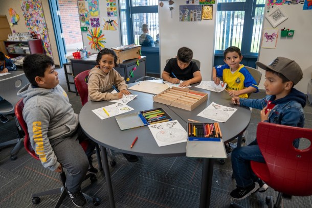 First-graders are excited to color in Andrea Rodriguez's classroom. Russell Stiger Jr. OBSERVER