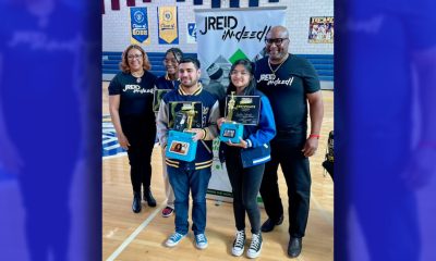 Justin Reid’s parents join Coding 4 the Culture’s champions as they proudly show off their music coding winnings. (Pictured L to R: Sharon Reid, third-place winner Alana Dolphin, first-place winner Luis Infante, second-place winner Faith Jotojot, and Eric Reid, Sr.)