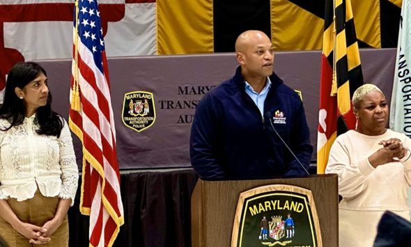 Maryland Governor Wes Moore gives updates on the collapse of the Francis Scott Key Bridge in Baltimore on April 1 and efforts to recover from the disaster with Lt. Gov. Aruna Miller (left) and April Jackson-Woodard, a freelance sign language interpreter, at his side. (AFRO Photo / Alexis Taylor)