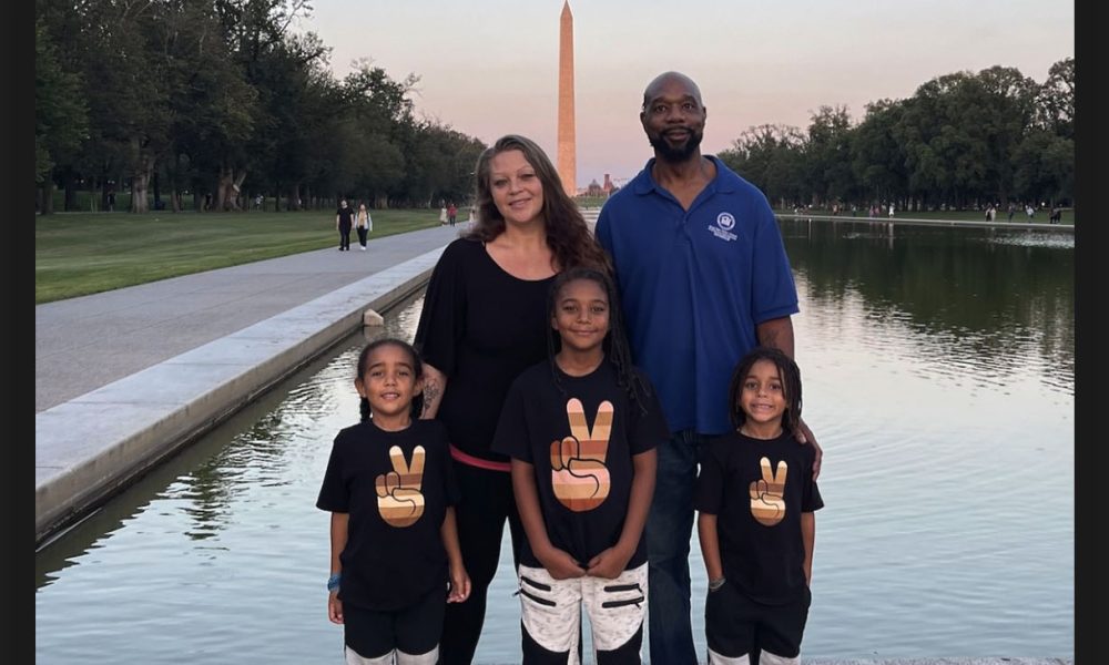 Masada with his family with The Washington Monument in the background