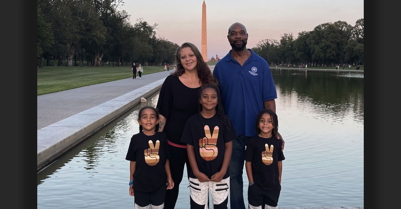 Masada with his family with The Washington Monument in the background